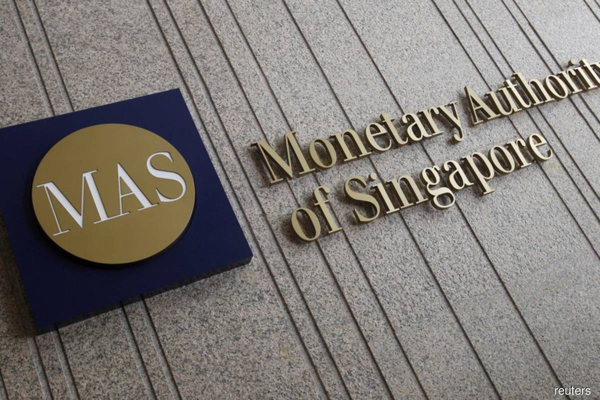 Singapore central bank tightens policy in surprise move